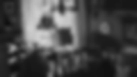 Black and white image of the environment in Doktorsgården - lamps, paintings and furniture are visible.