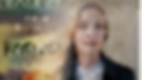 The front cover of the book "Destroy the World Tonight" is overlapped by a portrait of a woman with long blonde hair.