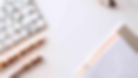 Illustration image with keyboard, pen, writing pad and glasses. Photo: Jess Bailey, Unsplash