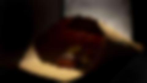 Brown paper cone with caramels in it.